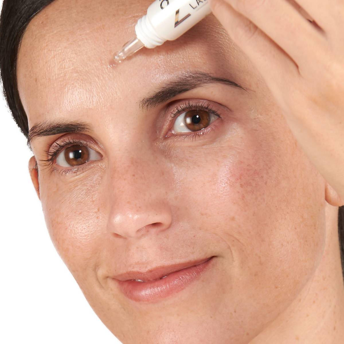 Woman applying No7 Early Defence Eye Cream