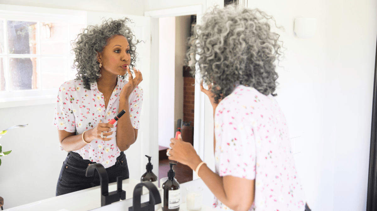 woman applying makeup